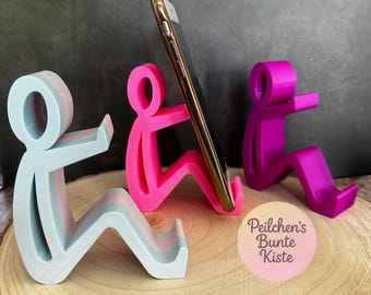 Humorvolle Smartphone-Halterung – sitzende Figur als Handy-Ständer, witziges Geschenk/ Büro- & Schreibtisch-Deko in vielen Farben erhältlich