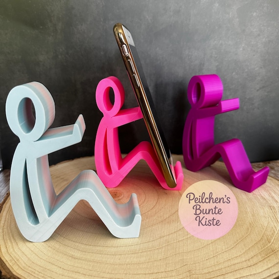 Humorvolle Smartphone-Halterung – sitzende Figur als Handy-Ständer, witziges Geschenk/ Büro- & Schreibtisch-Deko in vielen Farben erhältlich
