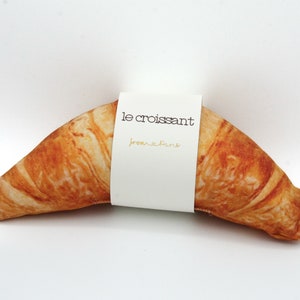 Very realistic croissant dog toy plush with squeaky element