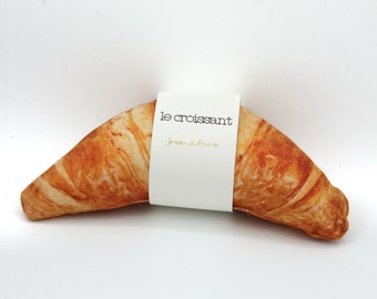 Very realistic croissant dog toy plush with squeaky element