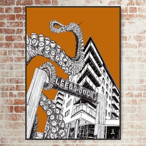 May include: A black and white ink illustration on an orange background featuring a large octopus tentacle wrapping around a modern building structure with a sign that clearly reads LEEDS DOCK, set within a thin black rectangular frame.