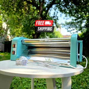 May include: A light blue electric rotary ironer featuring two polished metal rollers, a white power cord with a plug, and two orange power switches on the side panel. The device has a printed label indicating a width of 19.7 inches.