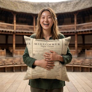 May include: A square beige throw pillow featuring a printed reproduction of the title page and text from A MIDSOMMER Nights Dreame. The pillow has a vintage paper appearance with dark brown typography and decorative borders on a light tan background.