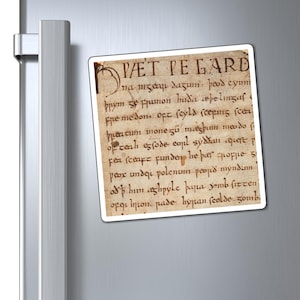 May include: A rectangular magnet with a printed image of an old manuscript page. The text is in a faded brown ink on a cream-colored background. The magnet is attached to a silver refrigerator door.