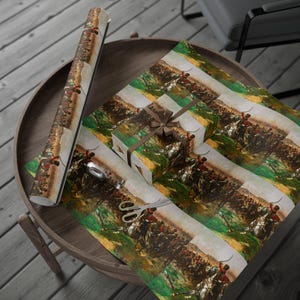 May include: Wrapping paper featuring a repeating historical battle scene with soldiers on horseback in red uniforms, green fields, and brown earth tones. The paper is shown as a rolled tube and a gift-wrapped box tied with a brown ribbon and bow.