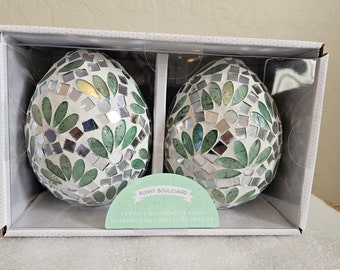 Pretty Glass Tile Mosaic Egg. it picks up the light and flashes it back to you as you walk by it.