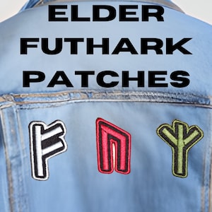 May include: A blue denim jacket with three embroidered patches featuring Elder Futhark runes. The runes are F, N, and Y. The patches are in white, red, and green.