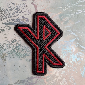 May include: Red embroidered iron-on patch with a black background featuring a Norse rune symbol.