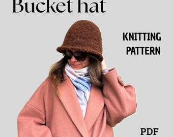 May include: A brown bucket hat is featured in this image. The hat is made of a textured material and has a slightly flared brim. The words "Bucket hat" are at the top of the image. The words "Knitting Pattern" and "PDF" are also visible.