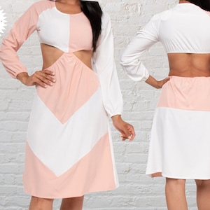 May include: A long-sleeved dress with a cut-out design. The dress is white and pink with a geometric pattern. The dress has a scoop neck and long sleeves.
