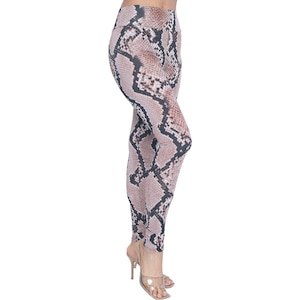 May include: A pair of brown and black snake print leggings. The leggings are fitted and have a high waist.