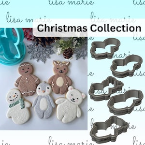 May include: A set of five Christmas cookie cutters in the shape of a snowman, penguin, gingerbread man, reindeer, and polar bear. The cutters are made of metal and have a silver finish. The cutters are arranged on a white background with a festive Christmas theme.