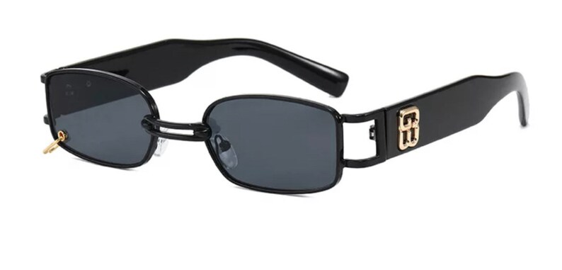May include: Black rectangular sunglasses with a gold logo on the side. The sunglasses have a thin metal frame and dark lenses.