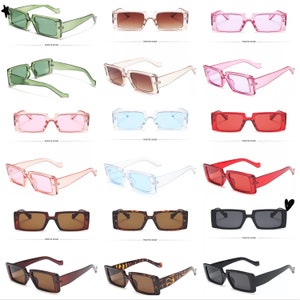 May include: A set of 12 pairs of square-shaped sunglasses in various colors, including green, brown, pink, blue, red, and black. The sunglasses have a rectangular frame and are made of plastic.
