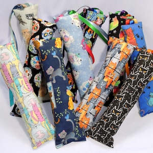 Medium Cat Kicker Toy with Ribbons. 10” to 11” long. Quality Catnip + Silver Vine. 15+ Patterns Cat Themed Cotton Fabrics. Free Shipping!