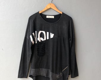Top de manga larga desgastado estilo punk vanguardista