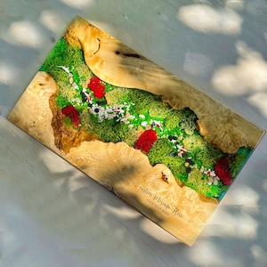 May include: A rectangular wooden resin art piece featuring a vibrant green moss landscape with red accents and small white stones. The edges are natural wood, and the piece includes the text "custom MESSAGE Here" and "YOUR TEXT HERE".