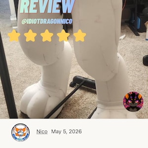 May include: A pair of white, padded furry legs, part of a costume, with a paw-like foot design. The image includes text that says "CUSTOMER REVIEW" and "@IDIOTDRAGONNICO" with a five-star rating. The legs are on a carpeted floor.