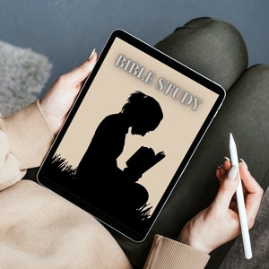 May include: A person is sitting in a chair and using a tablet to study the Bible. The tablet screen shows a silhouette of a person reading a book with the words "Bible Study" at the top.