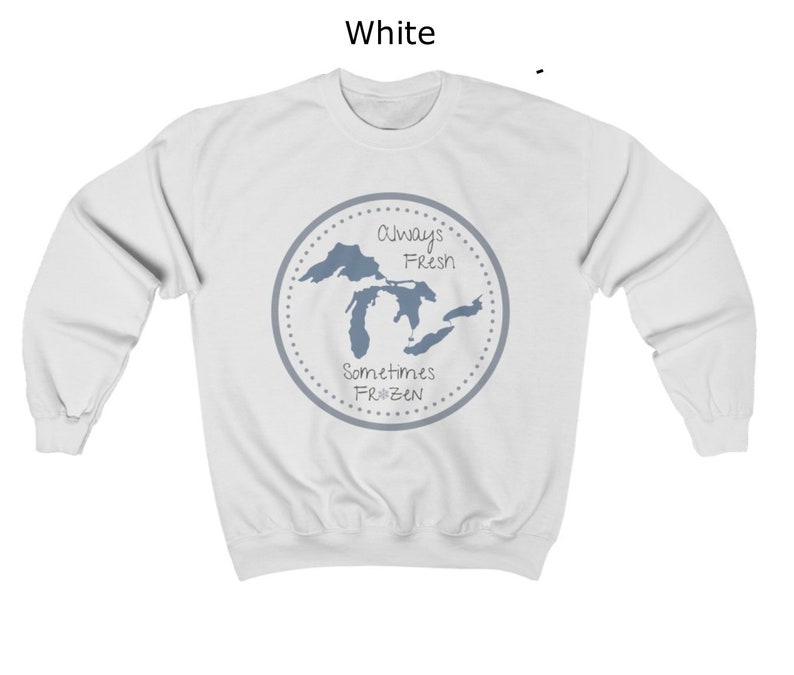 May include: White sweatshirt with a blue graphic of the Great Lakes. The graphic has the text "Always Fresh Sometimes Frozen" in a circle.