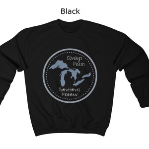 May include: Black sweatshirt with a graphic of the Great Lakes. The graphic is a circle with a dotted border and the text "Always Fresh Sometimes Frozen".