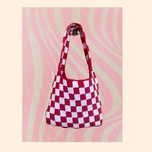 May include: Red and white checkered crochet tote bag with a single strap.