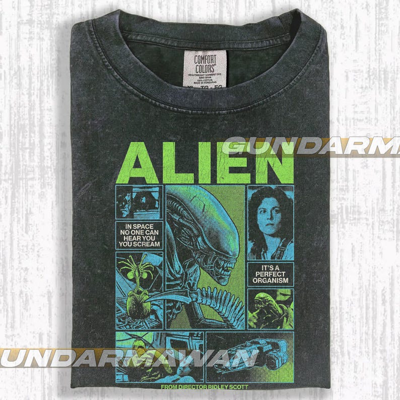 Pode incluir: T-shirt cinzenta escura com um design gr&aacute;fico do filme "Alien". O design inclui a palavra "ALIEN" em verde, imagens do alien&iacute;gena e os textos "IN SPACE NO ONE CAN HEAR YOU SCREAM" e "IT'S A PERFECT ORGANISM."