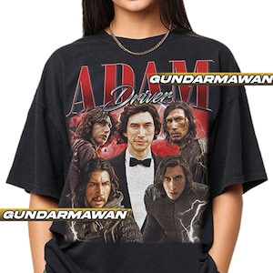 May include: Black t-shirt featuring a graphic of Adam Driver with the text "ADAM Driver" in red and white. The design includes multiple images of the actor. The shirt has a vintage, distressed look.