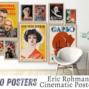 May include: A collection of vintage movie posters featuring black and white images of actors and actresses. The posters are framed and displayed on a white wall. The posters are in various sizes and feature different movie titles, including "Gentleman Mommer Stan", "Mr. Moto", "Cooper Arthur", "Synd Som Lockar", "Greta Garbo", "Kvinnsolangeiset", "Charles Chaplin", "Lilla Froken Skagg", and "Mid Natts Klub Ben".