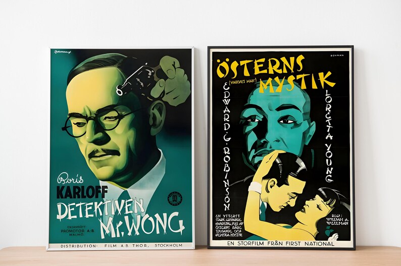 May include: Two vintage movie posters. The poster on the left is green and features Boris Karloff as Mr. Wong, a detective. The poster on the right is black and features Edward G. Robinson in "The Mystery of the Orient".