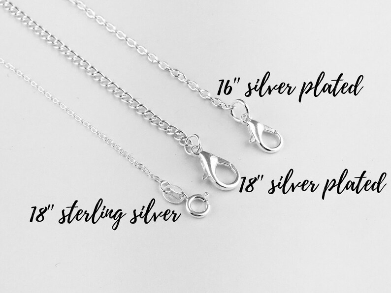 May include: Three silver chains, one sterling silver and two silver plated, with lobster clasps. The chains are 18 inches long, with the silver plated chains also available in 16 inches.