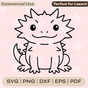 May include: Black and white cartoon illustration of a bearded dragon with spiky features, a smiling face, and text that says "Commercial Use" and "Perfect for Lasers!" on a pink background. File formats include SVG, PNG, DXF, EPS, and PDF.