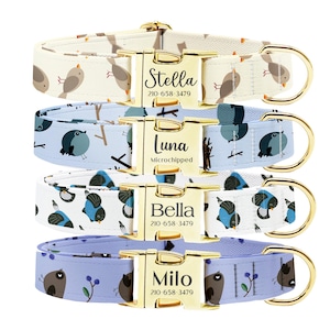May include: Four personalized dog collars with bird patterns in cream, light blue, and lavender. Each collar has a gold-colored buckle with a name and phone number. The collars are for Stella, Luna, Bella, and Milo.