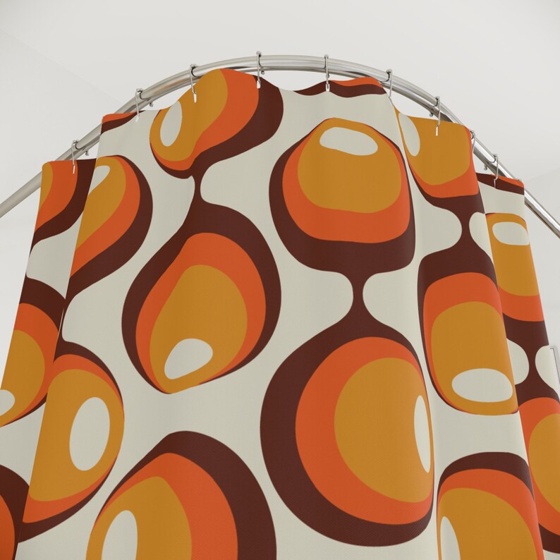 May include: A shower curtain with a retro pattern of orange, brown, and white circles. The circles are arranged in a repeating pattern and have a slightly textured look.