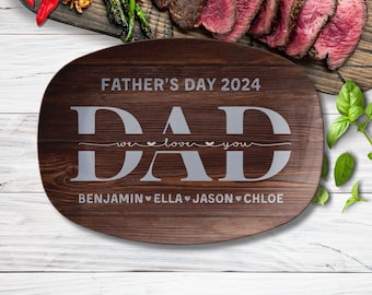 May include: A brown wooden serving platter with the text "Father's Day 2024" and "DAD we love you" in white lettering. The names "Benjamin, Ella, Jason, Chloe" are also written in white lettering.