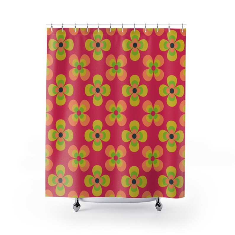 May include: A red shower curtain with a repeating pattern of multi-colored flowers. The flowers are yellow, orange, and green with black centers.