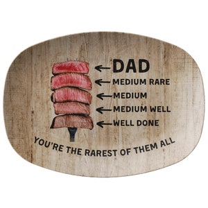 May include: A wooden serving platter with a graphic of a steak cooked to different levels of doneness. The text reads "DAD You're the rarest of them all".