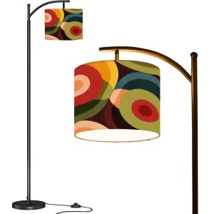 May include: A black arc floor lamp with a patterned lampshade. The lampshade displays overlapping circles in red, yellow, green, and blue. The lamp has a circular base and a curved arm. The height is approximately 170 cm.