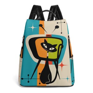 May include: A retro-style backpack featuring a black cat watching a television. The cat is sitting in front of a mid-century modern TV set. The backpack has a teal, orange, and cream color scheme with black straps and zippers.