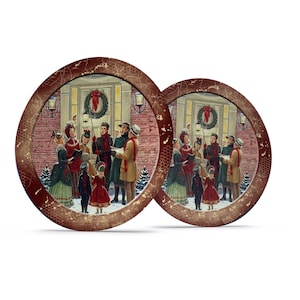 May include: Two round, brown, wooden coasters with a distressed finish. Each coaster features a vintage illustration of a group of people singing Christmas carols in front of a house.