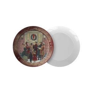 May include: A red and gold Christmas plate with a vintage illustration of carolers singing in front of a house with a wreath on the door.