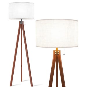 May include: Two tripod floor lamps with white linen drum shades. The lamps have a wooden base and a pull chain.