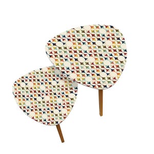 May include: A set of two nesting tables with a geometric pattern in shades of red, blue, green, yellow, and white. The tables have a triangular shape and wooden legs.