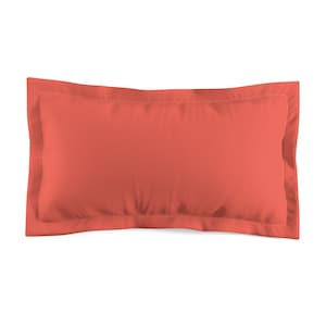 May include: A coral colored pillow with a simple design and a white border.