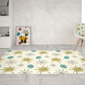 May include: A cream-colored rug with a mid-century modern design featuring black, yellow, and blue stars and circles.