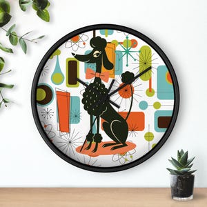 May include: A black and white clock with a retro design featuring a poodle and geometric shapes in orange, blue, green, and brown.