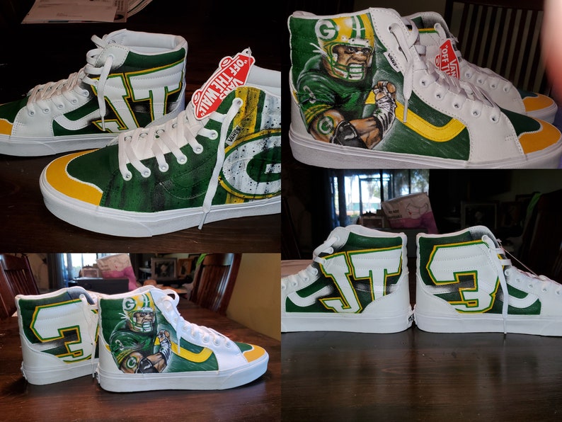 May include: Custom-painted high-top sneakers in white, green, and yellow, featuring a football theme. One pair showcases a player portrait, while the other displays the team's logo and initials. The shoes have white laces and soles.