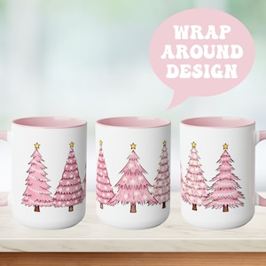 May include: A white mug with a pink rim and handle features a design of five pink Christmas trees with yellow stars on top. The mug is shown from three different angles, with the text "WRAP AROUND DESIGN" in a pink speech bubble above the mugs.