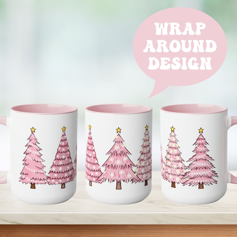 May include: A white mug with a pink rim and handle features a design of five pink Christmas trees with yellow stars on top. The mug is shown from three different angles, with the text "WRAP AROUND DESIGN" in a pink speech bubble above the mugs.