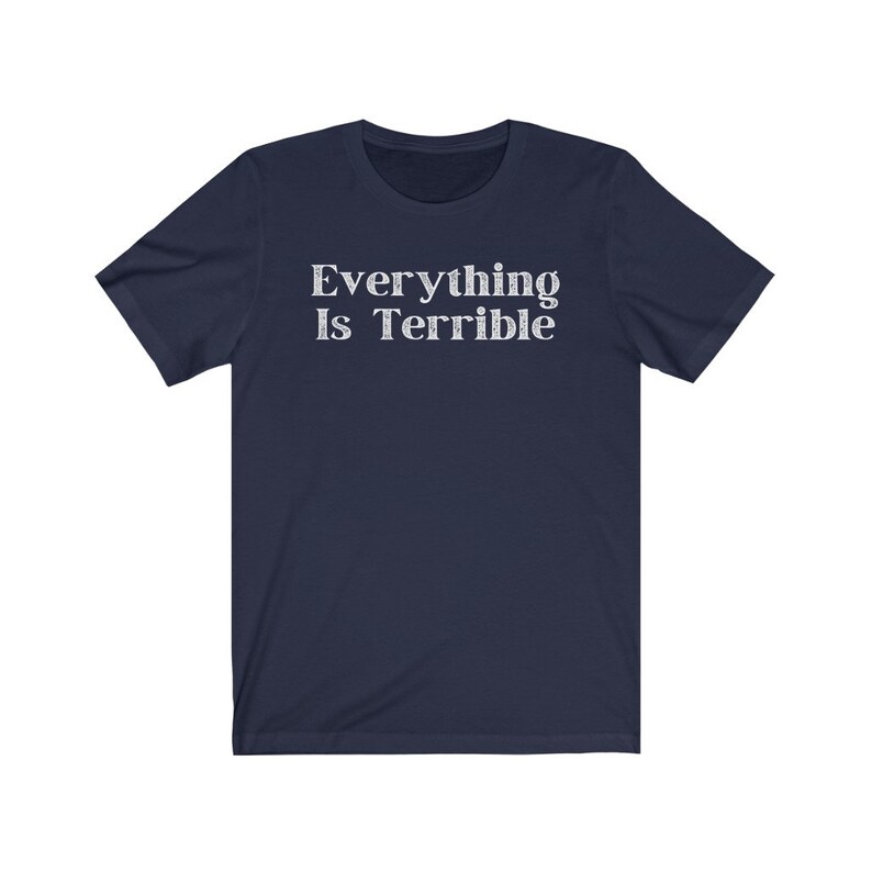 May include: Navy blue short-sleeved t-shirt with the text "Everything Is Terrible" printed in white.